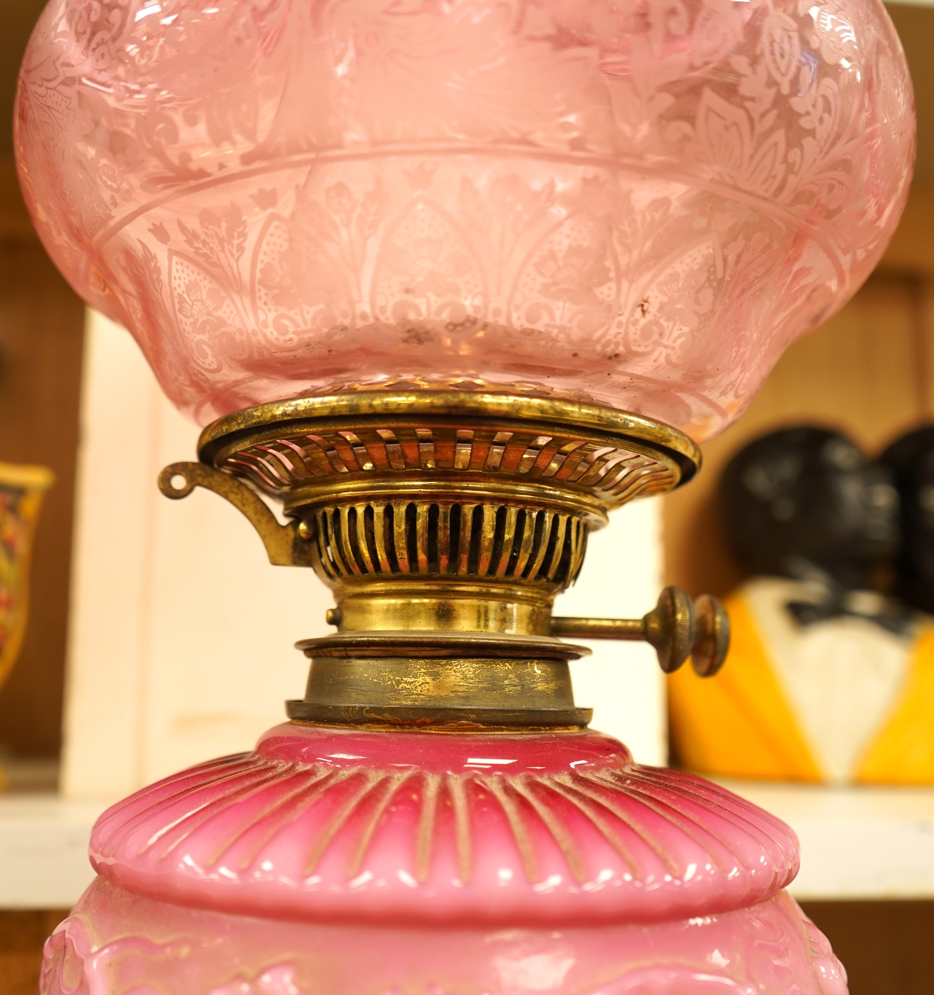 A Victorian brass and ruby glass oil lamp, 80cm high overall
